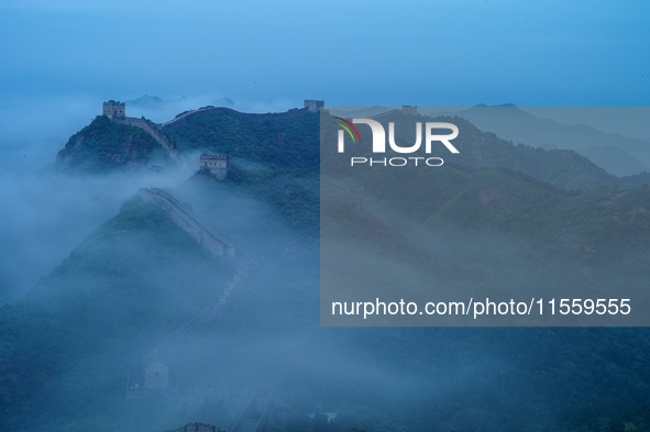 Clouds linger over the Jinshanling Great Wall after rain in Chengde, China, on September 8, 2024. 