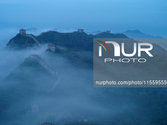 Clouds linger over the Jinshanling Great Wall after rain in Chengde, China, on September 8, 2024. (