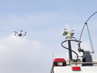 A police drone patrols over the city of Yantai in Yantai, China, on August 9, 2024. According to the Ministry of Industry and Information Te...