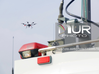 A police drone patrols over the city of Yantai in Yantai, China, on August 9, 2024. According to the Ministry of Industry and Information Te...