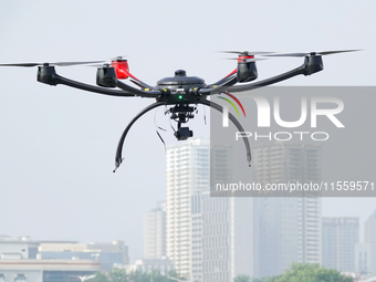 A police drone patrols over the city of Yantai in Yantai, China, on August 9, 2024. According to the Ministry of Industry and Information Te...