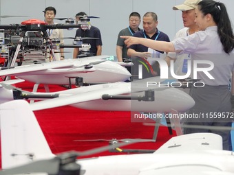 Visitors learn about drone products at an exhibition in Yantai, China, on September 5, 2024. According to the Ministry of Industry and Infor...