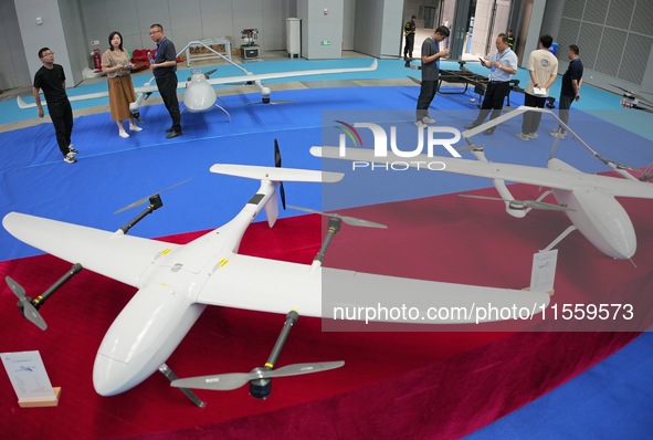 Visitors learn about drone products at an exhibition in Yantai, China, on September 5, 2024. According to the Ministry of Industry and Infor...