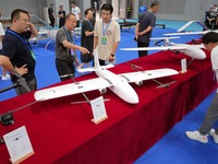 Visitors learn about drone products at an exhibition in Yantai, China, on September 5, 2024. According to the Ministry of Industry and Infor...