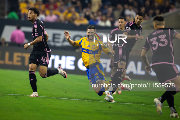 Tigres player Andre-Pierre Gignac (10) trips during a Leagues Cup match between Inter Miami and Tigres at NRG Stadium in Houston, Texas, on...