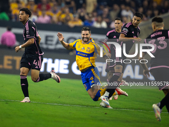 Tigres player Andre-Pierre Gignac (10) trips during a Leagues Cup match between Inter Miami and Tigres at NRG Stadium in Houston, Texas, on...