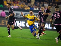 Tigres player Andre-Pierre Gignac (10) trips during a Leagues Cup match between Inter Miami and Tigres at NRG Stadium in Houston, Texas, on...