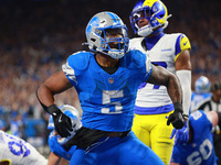 DETROIT,MICHIGAN-SEPTEMBER 8: Detroit Lions running back David Montgomery (5) celebrates after scoring a touchdow during overtime of an NFL...