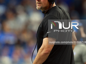 DETROIT,MICHIGAN-SEPTEMBER 8: Detroit Lions head coach Dan Campbell looks on from the sidelines  during a game between the Detroit Lions and...