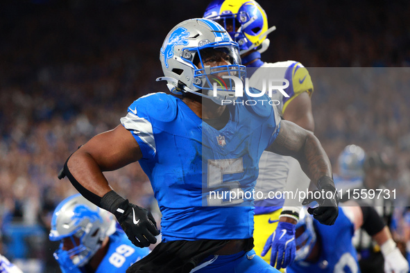 DETROIT,MICHIGAN-SEPTEMBER 8: Detroit Lions running back David Montgomery (5) celebrates after scoring a touchdow during overtime of an NFL...