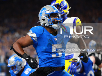 DETROIT,MICHIGAN-SEPTEMBER 8: Detroit Lions running back David Montgomery (5) celebrates after scoring a touchdow during overtime of an NFL...