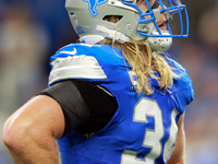 DETROIT,MICHIGAN-SEPTEMBER 8:  Linebacker Alex Anzalone (34) of the Detroit Lions looks up to the screen between plays during a game between...