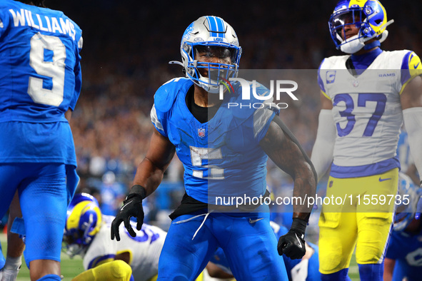 DETROIT,MICHIGAN-SEPTEMBER 8: Detroit Lions running back David Montgomery (5) celebrates after scoring a touchdow during overtime of an NFL...