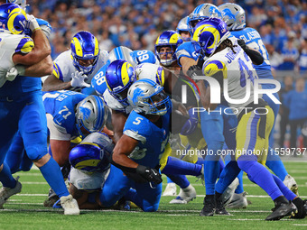 DETROIT,MICHIGAN-SEPTEMBER 8: Detroit Lions running back David Montgomery (5) runs the ball during overtime of an NFL football game between...