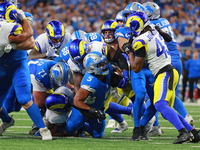 DETROIT,MICHIGAN-SEPTEMBER 8: Detroit Lions running back David Montgomery (5) runs the ball during overtime of an NFL football game between...