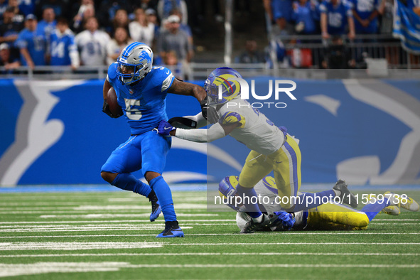 DETROIT,MICHIGAN-SEPTEMBER 8: Detroit Lions running back David Montgomery (5) runs the ball during overtime of an NFL football game between...