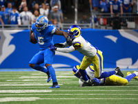 DETROIT,MICHIGAN-SEPTEMBER 8: Detroit Lions running back David Montgomery (5) runs the ball during overtime of an NFL football game between...