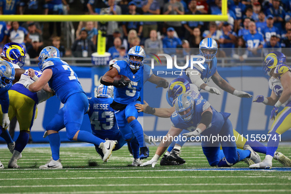 DETROIT,MICHIGAN-SEPTEMBER 8: Detroit Lions running back David Montgomery (5) runs the ball during overtime of an NFL football game between...