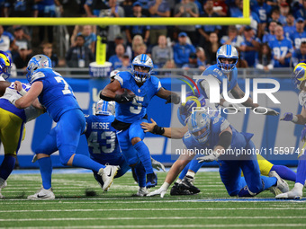 DETROIT,MICHIGAN-SEPTEMBER 8: Detroit Lions running back David Montgomery (5) runs the ball during overtime of an NFL football game between...