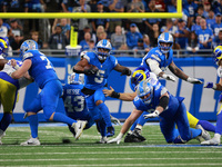 DETROIT,MICHIGAN-SEPTEMBER 8: Detroit Lions running back David Montgomery (5) runs the ball during overtime of an NFL football game between...