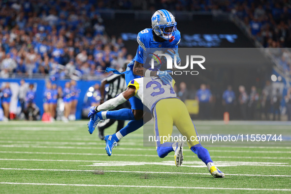 DETROIT,MICHIGAN-SEPTEMBER 8: Detroit Lions wide receiver Jameson Williams (9) is tackled by Los Angeles Rams safety Quentin Lake (37) durin...