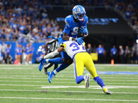 DETROIT,MICHIGAN-SEPTEMBER 8: Detroit Lions wide receiver Jameson Williams (9) is tackled by Los Angeles Rams safety Quentin Lake (37) durin...