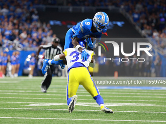 DETROIT,MICHIGAN-SEPTEMBER 8: Detroit Lions wide receiver Jameson Williams (9) is tackled by Los Angeles Rams safety Quentin Lake (37) durin...