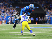 DETROIT,MICHIGAN-SEPTEMBER 8: Detroit Lions wide receiver Jameson Williams (9) is tackled by Los Angeles Rams safety Quentin Lake (37) durin...