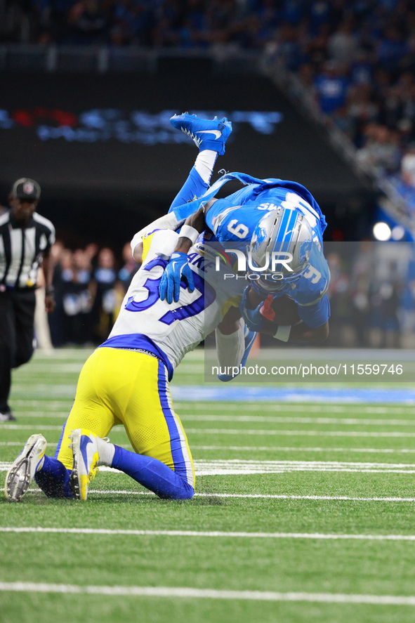 DETROIT,MICHIGAN-SEPTEMBER 8: Detroit Lions wide receiver Jameson Williams (9) is tackled by Los Angeles Rams safety Quentin Lake (37) durin...