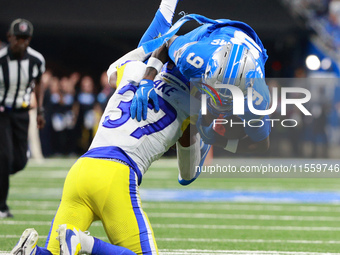 DETROIT,MICHIGAN-SEPTEMBER 8: Detroit Lions wide receiver Jameson Williams (9) is tackled by Los Angeles Rams safety Quentin Lake (37) durin...