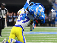 DETROIT,MICHIGAN-SEPTEMBER 8: Detroit Lions wide receiver Jameson Williams (9) is tackled by Los Angeles Rams safety Quentin Lake (37) durin...