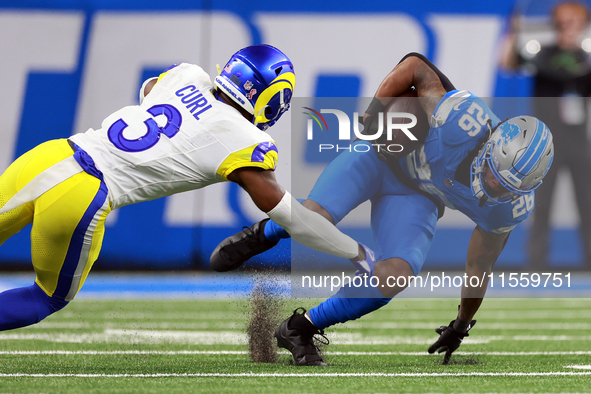 DETROIT,MICHIGAN-SEPTEMBER 8: 
Running back Jahmyr Gibbs (26) of the Detroit Lions is taken down by safety Kamren Curl (3) of the Los Angele...