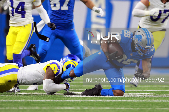 DETROIT,MICHIGAN-SEPTEMBER 8: 
Running back Jahmyr Gibbs (26) of the Detroit Lions is taken down by safety Kamren Curl (3) of the Los Angele...