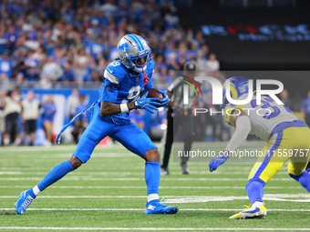 DETROIT,MICHIGAN-SEPTEMBER 8: Detroit Lions wide receiver Jameson Williams (9) runs the ball during the second half of an NFL football game...