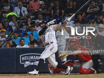 Christian Villanueva #14 of Sultanes de Monterrey hits the ball during the 2024 King Series match 3 against Diablos Rojos of the Mexican Bas...