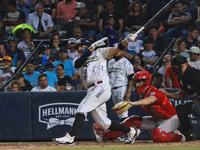 Christian Villanueva #14 of Sultanes de Monterrey hits the ball during the 2024 King Series match 3 against Diablos Rojos of the Mexican Bas...