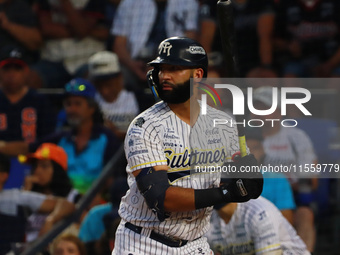 Nomar Mazara #15 of Sultanes de Monterrey bats during the 2024 King Series match 3 against Diablos Rojos of the Mexican Baseball League (LMB...