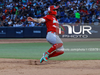 Juan Carlos Gamboa #47 of Diablos Rojos slides to the third base plate during the 2024 King Series match 3 against Sultanes de Monterrey of...