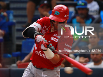 Julian Ornelas #31 of Diablos Rojos bats during the 2024 King Series match 3 against Sultanes de Monterrey of the Mexican Baseball League (L...