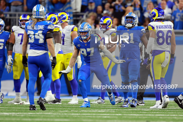 DETROIT,MICHIGAN-SEPTEMBER 8:  Defensive end Aidan Hutchinson (97) of the Detroit Lions celebrates a play during a game between the Detroit...