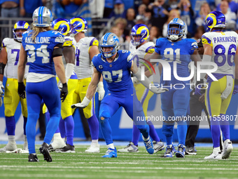 DETROIT,MICHIGAN-SEPTEMBER 8:  Defensive end Aidan Hutchinson (97) of the Detroit Lions celebrates a play during a game between the Detroit...