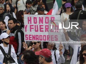 Demonstrators take part in the rally 'Great March for Mexican Democracy' against Mexican President Andres Manuel Lopez Obrador's controversi...