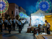 The band opens the procession in Via Dante among the stalls on the occasion of the patron saint's day in Molfetta, Italy, on September 8, 20...