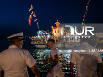 The statue of Our Lady of Martyrs is withdrawn from the sea on three fishing boats accompanied by sailors on the occasion of the patronal fe...