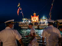 The statue of Our Lady of Martyrs is withdrawn from the sea on three fishing boats accompanied by sailors on the occasion of the patronal fe...