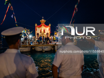 The statue of Our Lady of Martyrs is withdrawn from the sea on three fishing boats accompanied by sailors on the occasion of the patronal fe...