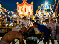 The statue of Our Lady of Martyrs is withdrawn from the sea on three fishing boats accompanied by sailors on the occasion of the patronal fe...