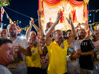 Sailors celebrate in front of the statue of Our Lady of Martyrs on the occasion of the patronal feast day in Molfetta, Italy, on September 8...