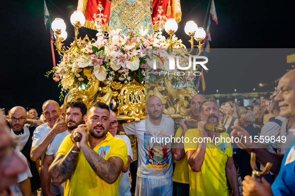 Sailors carry the statue of Our Lady of Martyrs on the occasion of the patronal feast day in Molfetta, Italy, on September 8, 2024. Septembe...