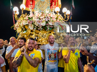 Sailors carry the statue of Our Lady of Martyrs on the occasion of the patronal feast day in Molfetta, Italy, on September 8, 2024. Septembe...